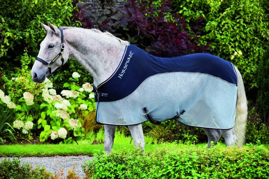 Grey horse wearing Horseware Ireland cooler