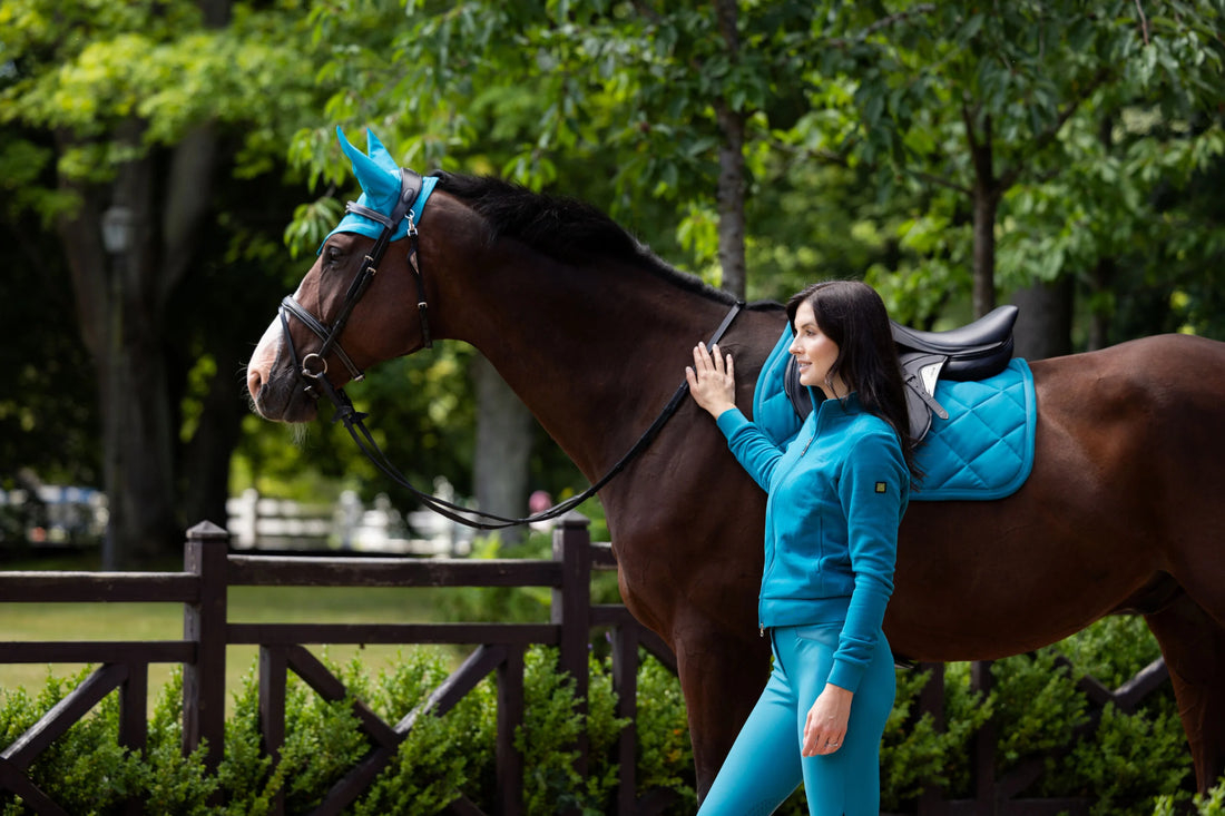 Woman and horse wearing blue Equiline apparel