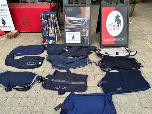 The Equiline custom blankets displayed outside our Tryon store