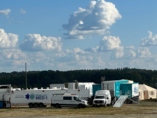 FEMA and first aid trucks at Tryon Equestrian Center after Hurricane Helene